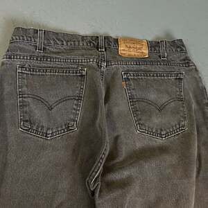 Vintage 90s Made in USA Levi's 560 Tapered Leg Orange Tab Jeans Black